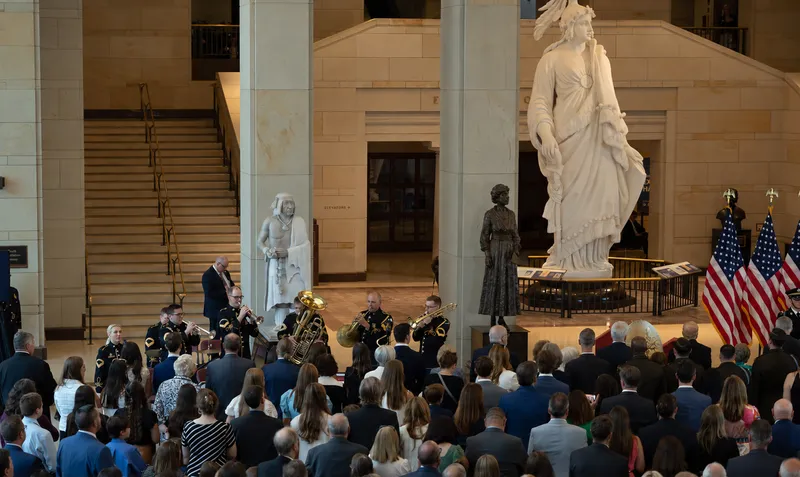 A military brass ensemble performing at a ceremony inside the Capitol Visitor Center