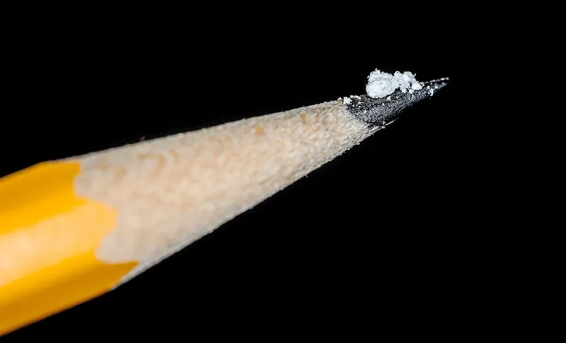 A Drug Enforcement Administration photo illustration showing two milligrams of fentanyl powder on the tip of a pencil