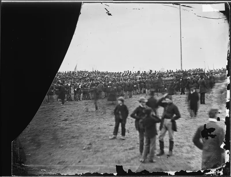 Civil War-era photograph from the National Archives showing a large crowd of citizens and soldiers gathered at Gettysburg in 1863